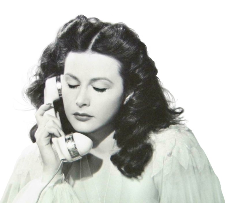 Black and white photo of Hedy Lamarr speaking into a telephone and blinking