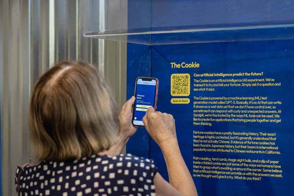 A visitor scanning the unit's QR code to access the web app