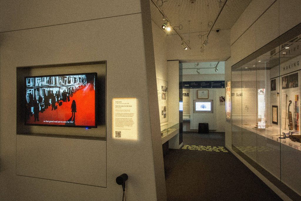 Screens and display cases inside the gallery space