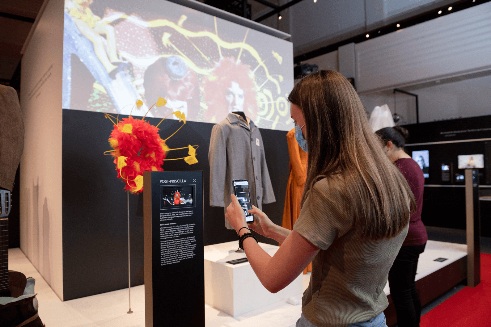 People interacting with the exhibition